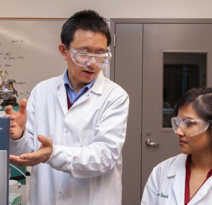 Professor and student in lab