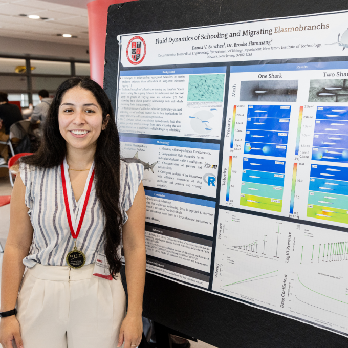 A student presenting next to their research at Dana Knox Research Showcase