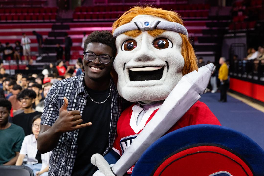A student and Highlander at Convocation